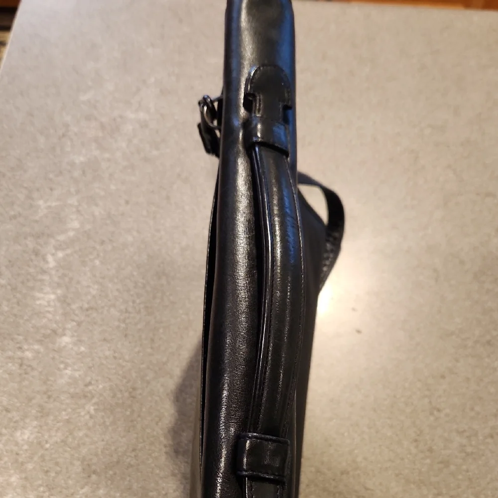 Tandi black leather briefcase featuring both top handles adjustable strap P-001